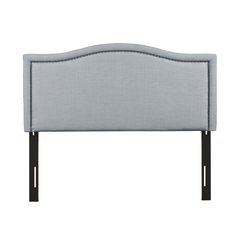 an upholstered headboard with black legs and grey fabric, on a white background