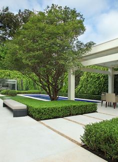 an outdoor living area with seating and trees