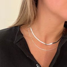 The Como is a 3mm 925 sterling silver herringbone necklace. This necklace is the perfect addition to an outfit with t-shirt and jeans. Pair with the Delilah necklace for a complete silver stack. Sterling Silver Chain Necklace For Layering, Trendy Herringbone Necklace For Everyday, Trendy Herringbone Necklace With Delicate Chain For Gift, Silver Minimalist Herringbone Necklace, Silver Snake Chain Choker Necklace For Gift, Layering Snake Chain Necklace, Silver Minimalist Herringbone Choker, Dainty Snake Chain Necklace For Layering, Trendy Silver Snake Chain Jewelry