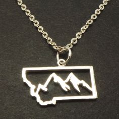 "Montana Mountain necklace was made and inspired by montana wildlife. Base Material: Sterling Silver Crafting Time: 7 - 10 working days Size: 23mm X 12mm (Approximately Plus Hoop. Please refer to the picture above) Metal Stamped: 925 Thickness: 1mm (Approximately.) If you need the item urgently, please contact us for Express Mail. There are extra cost for Express service. You'll receive Order Shipped Email from us when your item is completed and shipped. SPECIAL ANNOUNCEMENT 1. Please visit http Adjustable Nature-inspired Jewelry For Outdoor, Adjustable Nature-inspired Outdoor Jewelry, Outdoor Handmade Pendant Jewelry, Mountain Necklace Silver, Hope Motivation, Montana Mountains, Moon Necklace Silver, Mountain Jewelry, Montana State