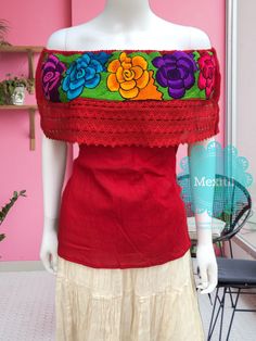 "Mexican Off shoulder top with colorful floral embroidery. Made out of corrugated manta, 100% cotton. Please note: each piece is unique, the embroidery on the top and belt may be slightly different from the one pictured. Dimensions: Small/ Medium Bust- 42\" Length- 22\" Large/ XL Bust- 47\" Length- 23\" 🧵Made in Chiapas, Mexico. 🧺Care Instructions: We recommend hand washing, lay flat to dry. 📲Please feel free to message me with any questions regarding sizing and fit. 📷Additional photos can b Bohemian Red Tops With Embroidered Hem, Bohemian Red Top With Embroidered Hem, Red Bohemian Top With Embroidered Hem, Red Floral Embroidered Top For Festival, Red Tops With Floral Embroidery For Festivals, Red Bohemian Embroidered Top, Bohemian Red Embroidered Top, Folk Style Floral Print Tops For Festivals, Red Folk Style Top With Floral Print