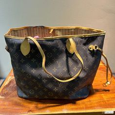 Vintage Louis Vuitton Authentic "Neverfull" Has some worn areas around the Top Trim that can be seen in Photos Has some Black Spots That can Be seen in the Photos This is LV's Most Popular Bag Popular Bags, Top Handle Bags, Vintage Louis Vuitton, Black Spot, Purses And Handbags, Top Handle, Labour Day, Most Popular, Art Collection