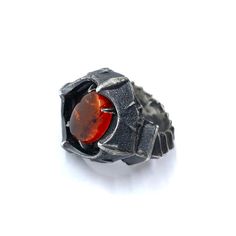 Inspired by Sauron’s plate mail, all spiked and segmented. It instills fear in those on the battle field. This ring has an incredible presence to it. Oxidized dark and hand textured on each of the plates. Set with a gorgeous amber cabochon that pops with vivid color, but is also protected by the armored setting. over time the oxidation will wear away at the high points leaving the recesses darker. cast in solid sterling silver, this piece had a great heft to it. Need your ring in a quarter size Gothic Hand Cast Metal Rings, Gothic Metal Rings, Gothic Hand Cast Ring Jewelry, Gothic Oxidized Finish Rings As Gift, Gothic Oxidized Finish Rings For Gift, Gothic Metal Rings With Oxidized Finish, Gothic Oxidized Rings For Gift, Gothic Rings With Oxidized Metal Finish, Gothic Rings With Oxidized Finish For Gift