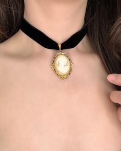 PLEASE READ DESCRIPTION CAREFULLY: Black velvet choker with VINTAGE Whiting & Davis Cameo pendant  ✨ Made with high quality, double sided velvet! Adjustable gold plated brass chain with lobster clasp in back. One size fits most! Materials may not be suitable for those with skin allergies.  These necklaces are not suitable to wear in water, as it will tarnish the quality. Please handle your necklace with care. I find the best way to attach the clasp and chain is from the front of the neck! Once a Elegant Luxury Cameo Necklace, Vintage Cameo Choker Necklace, Cameo Necklace Outfit, Black Dress Gold Jewelry, Evelyn Core, Gold Goth, Cameo Choker, Coquette Jewelry, Necklace Outfit