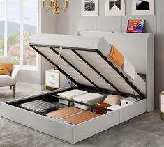 an open bed frame with drawers underneath it