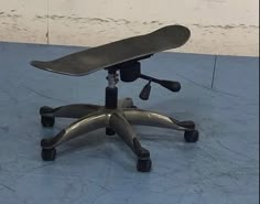 an office chair with a skateboard on top of it