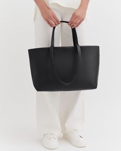 A petite version of our beloved tote, designed to go everywhere, made from soft and lightweight Italian leather. Tote Organizer Insert, Tote Insert, Small Leather Accessories, Interior Organization, Small Zipper Pouch, Tote Organization, Leather Industry, Lightweight Bag, Leather Wear