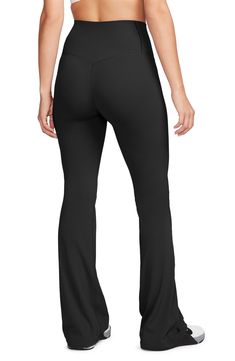 These subtly flared leggings boast signature moisture-wicking tech to keep you moving comfortably. 32" inseam, 19" leg opening; 9 1/2" front rise; 13" back rise (size Medium) Elastic waist Dri-FIT moisture-wicking technology 63% nylon, 37% spandex Machine wash, line dry Imported Sleek Black Leggings With 4-way Stretch, Sleek Black 4-way Stretch Leggings, Sleek Elastane Gym Bottoms, Fitted Wide Leg Moisture-wicking Yoga Pants, Moisture-wicking Fitted Wide Leg Yoga Pants, Moisture-wicking Fitted Wide-leg Yoga Pants, Sleek Sports Bottoms In Elastane, Black Flare Activewear For Workout, Black Mid-rise 4-way Stretch Yoga Pants