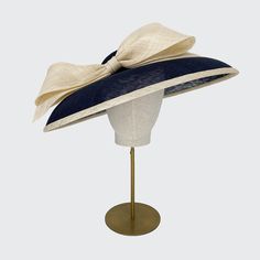 The navy bell with natural edge and bow from the Rachel Trevor Morgan collection is suitable for all occasions such as weddings, garden parties, investitures and racing events. Meets Royal Enclosure size requirements. Set with an elastic. Rachel Trevor Morgan, Bespoke Hats, Navy Hat, Navy Hats, The Rachel, Elegant Hats, Natural Edge, Vintage Hats, Royal Ascot