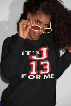 a woman wearing sunglasses and a black sweatshirt with the words it's 13 for me on it