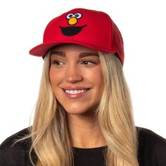 This Sesame Street hat is the ultimate accessory for the young or the young at heart. This bright red hat features a high-quality embroidered Elmo face on the crown, with a pre-curved brim and an adjustable snapback, ensuring a great fit for heads of all sizes. The sturdy yet lightweight construction makes it ideal for daily wear, outdoor adventures, or showcasing your Elmo admiration at themed events and parties. This snapback hat is a unique collector's item for Sesame Street enthusiasts. Novelty Snapback Hat, Red Flat Brim Baseball Cap With Embroidered Logo, Fun Baseball Cap With Embroidered Logo, Fun Cap With Embroidered Logo, Red Flat Brim Baseball Cap For Fan Gear, Fun Embroidered Logo Baseball Cap, Red Flat Brim Baseball Cap For Fans, Fun Embroidered Logo Cap, Novelty Red Baseball Cap