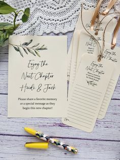 wedding stationery with tags and pen on wooden table