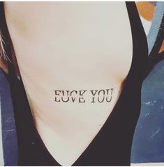 the back of a woman's neck with an inscription on it that says, i love you