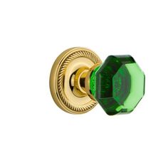 an image of a green door knob on a white background, with the handle in gold plated brass