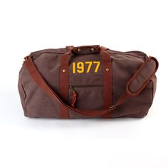 Travel in style with our vintage-inspired canvas holdall, a perfect blend of timeless design and modern functionality. Whether you're heading on a weekend getaway or need a reliable gym bag, this durable and spacious holdall is designed to carry it all. Personalise it with your name, initials, or a custom message for that extra special touch. Key Features: Premium Canvas: Crafted from high-quality, heavy-duty canvas for durability and style. Vintage Design: Inspired by classic travel bags, featu Vintage Duffle Bag With Adjustable Strap For Everyday, Vintage Duffle Bag With Leather Handles, Canvas Duffle Bag With Leather Handles For On-the-go, Vintage Leather-lined Satchel Duffle Bag, Brown Duffle Bag With Adjustable Strap For On-the-go, Holdall Bag, Weekend Bag, Baby Bag, Weekender Bag