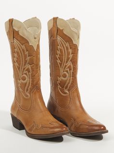 Channel the spirit of the wild with this chic western boot, a fusion of timeless style and effortless comfort. Embrace the easy-going elegance of this slip-on boot, featuring dual pull-tabs for easy wear and classic western stitching that adds a touch of rustic charm. Whether you're roaming city streets or exploring the open range, these boots will elevate your style with a touch of untamed spirit. Bohemian Boots For Rodeo In Fall, Bohemian Boots For Ranch In Fall, Fall Western Mid-calf Boots For Western-themed Events, Bohemian Rodeo Boots For Fall, Fall Western-style Mid-calf Boots For Western-themed Events, Bohemian Rodeo Fall Boots, Bohemian Fall Rodeo Boots, Western Style Mid-calf Boots For Fall Events, Rugged Boots For Country Events In Fall