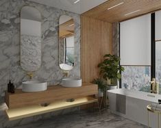 a bathroom with two sinks and a bathtub next to a window overlooking the city