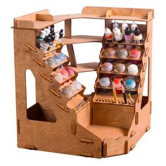 a wooden box filled with lots of crafting supplies on top of a white background