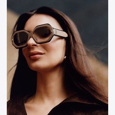 A striking design combines irregular frames with retro glamour. The layered acetate sunglasses are detailed with front metal stitches and our signature logo on the two-toned temples. Modern Sunglasses With Mirrored Lenses For Fashion, Chic Acetate Sunglasses With Uva Protection, Trendy Acetate Shield Sunglasses With Gradient Lenses, Chic Brown Shield Sunglasses With Gradient Lenses, Modern Acetate Shield Sunglasses, Geometric Sunglasses, Festival Shoes, Retro Glamour, Sunglasses Women Designer