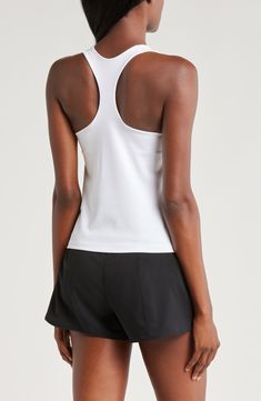 A built-in shelf-bra keeps you supported in this racerback tank top cut with signature Dri-FIT technology for cool, dry comfort as you work up a sweat. 20 1/2" length (size medium) Scoop neck Racerback Built-in shelf-bra Dri-FIT moisture-wicking technology 82% polyester, 18% spandex Machine wash, line dry Imported Sporty T-back Tank Top With Medium Support, Sporty Tank Top With Medium Support And T-back, Athleisure T-back Top For Training, Breathable Fitted Racerback Tank Top, Fitted Breathable Racerback Tank Top, Fitted T-back Tank Top For Sports, Athleisure T-back Training Top, Athleisure T-back Top For Sports, Fitted Moisture-wicking Racerback Top