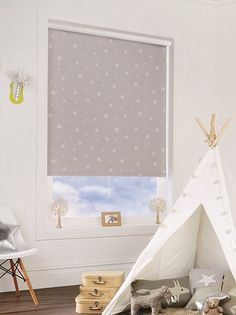 a child's room with a teepee and stuffed animals