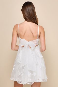 You'll always be ready to charm in the Lulus Divinely Sweet White Tulle Embroidered 3D Floral Mini Dress! Lightweight tulle fabric boasts a pattern of dainty embroidery and three-dimensional floral applique details. Adjustable spaghetti straps support a seamed bodice with a straight neckline and a high, empire-style waist. Turn around to reveal a sultry open back with an adorable, sheer sash tie. Flaring babydoll skirt has an extra layer of tulle for volume and ends at a mini hem. Elastic at bac Short Reception Dress For Bride, Babydoll Skirt, Tie Embroidery, Dainty Embroidery, Reception Dress Short, Simple Homecoming Dresses, White Dresses Graduation, Lulu Fashion, White Tulle