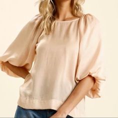 Satin High Low Hem Blouse With Half Balloon Sleeves By Umgee Clothing Casual Beige Blouse With Balloon Sleeves, Feminine Beige Tops For Day Out, Casual Puff Sleeve Knit Top For Summer, Casual Summer Knit Top With Puff Sleeves, Beige Short Sleeve Padded Blouse, Solid Color Summer Tops With Blouson Sleeves, Spring Crew Neck Top With Blouson Sleeves, Beige Crew Neck Blouse For Spring, Chic Beige Crew Neck Blouse