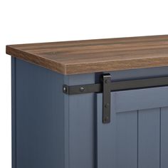 a kitchen island with wooden top and metal handles