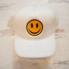 If you are happy and you know it wear your hat. Get one in every color. Free shipping and a free gift with purchase. Casual Smiley Face Hat With Curved Brim, Trendy Smiley Face Baseball Cap With Curved Brim, Trendy Smiley Face Hat With Curved Brim, Casual Smiley Face Snapback Hat, Funny White Hat For Gift, Funny White Hat As Gift, Trendy Curved Brim Hat With Smiley Face, Funny White Hat As A Gift, Adjustable Smiley Face Cap