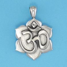 DESCRIPTION OM is the sacred sound of the universe. Chanting the OM during meditation positively impacts the mind and body. This elegant pendant will remind of that powerful feeling. Original design by Pat Frey 1 5/16 inch length. Type: Three Dimensional. Item Number: 1324 Spiritual Large Pendant Jewelry For Meditation, Oxidized Pendant For Meditation, Oxidized Finish Pendant For Meditation, Spiritual Oxidized Flower Pendant Jewelry, Spiritual Oxidized Finish Jewelry For Meditation, Spiritual Jewelry With Large Pendant, Spiritual Necklaces With Oxidized Finish For Meditation, Symbolic Oxidized Finish Necklace For Meditation, Holistic Handmade Jewelry For Yoga