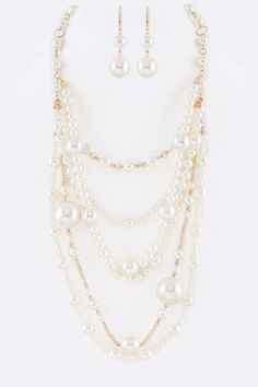 Mix Pearl Statement Layer Necklace Set Experience the elegance of layered pearls with this statement necklace set. This set includes multiple strands of pearls, creating a luxurious and classic look that will elevate any outfit. Made with high-quality materials, this necklace set is built to last and perfect for special occasions or adding a touch of sophistication to your everyday style.Necklace 1- 19" + ExtensionNecklace 2- 26"Earrings - 2.25" DropLead & Nickel Compliant Pearl Necklace Designs Unique, Layered Pearls, Pearl Necklace Designs, Layered Necklace Set, Layer Necklace, Hair Collection, Brand Collection, Sweater Sale, Style Necklace