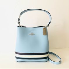 Nwt Coach Small Town Bucket Bag And In Colorblock With Stripe In Black And White Over Blue Pebbled Leather With Silver Hardware. This Convertible Bag Can Be Held In Hand Or Worn As A Shoulder Bag Or Crossbody Bag. Perfect As A Gift Or Daily Use. Color: Sv/Waterfall Midnight Multi Pocketbook Details: Polished Pebble Leather Center Zip Compartment Snap Closure Handle With 6 3/4" Drop Detachable Strap With 22" Drop For Shoulder Or Crossbody Wear 8 1/2" (L) X 8 3/4" (H) X 4" (W) Style No. C4080 Designer Blue Rectangular Bucket Bag, Luxury Blue Shoulder Bucket Bag, Designer Blue Bucket Bag For Travel, Luxury Blue Bucket Bag, Designer Blue Bucket Bag, Blue Bucket Bag With Detachable Handle For Errands, Blue Luxury Pouch Bucket Bag, Luxury Blue Pouch Bucket Bag, Modern Blue Bucket Shoulder Bag