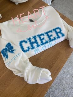 Personalized Embroidered Cheer Mom Sweatshirt Custom Team Crewneck Cheer Mom Bow Shirt With Kids Name on Sleeve Cheerleading Shirt - Etsy Game Day White Sweatshirt With Embroidered Graphics, White Team Spirit Sweatshirt With Embroidered Graphics, White Game Day Sweatshirt With Embroidered Graphics, White Sweatshirt With Embroidered Graphics For Team Spirit, White Custom Embroidered Top For College, School Spirit Embroidered Tops For Game Day, White Team Spirit T-shirt With Embroidered Graphics, White School Spirit Sweatshirt With Letter Embroidery, Embroidered School Spirit Tops For Game Day