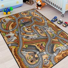 a child's play area with toy cars and trucks on the rug in front of a crib