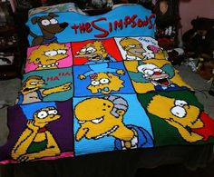 a bed with the simpsons characters on it