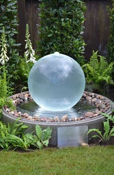 a water feature in the middle of a garden