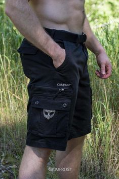 Unique cargo shorts made from black high-density twill that will stand the test of time. They have a vintage garment wash, come with a robust, woven belt and a reinforced backside. With no less than 9 pockets, they will hold and hide most of your belongings. Inspired by the past and made for the modern Viking, the shorts come with a Viking twist including Grimfrost's helmet and "Freyr Viki" prints, Viking artwork embroidery Younger Futhark runic circle buttons. #grimfrost Tactical Outdoor Shorts With Cargo Pockets, Tactical Cargo Shorts For Outdoor, Outdoor Techwear Cotton Shorts, Cotton Techwear Shorts With Multiple Pockets, Cotton Techwear Shorts For Outdoor, Techwear Cotton Shorts For Outdoor, Black Cotton Cargo Shorts For Outdoor Activities, Cargo Shorts With Belt Loops For Outdoor Activities, Cotton Cargo Shorts With Built-in Shorts For Outdoor Activities