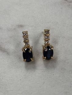 "14kt Yellow Gold Lady's Diamond and Sapphire Earrings consisting of 2- 6mm x 4mm oval genuine bright blue Sapphires 1.00ct approx total weight and 6 full cut round brilliant diamonds .18ct total weight SI1 clarity, G color all prong set with posts and friction backs. These earrings are 1/2\" in length and are the perfect day to day earrings to compliment any wardrobe. This item would Retail for $890.00" Classic Oval Sapphire Diamond Earrings, Oval Sapphire Earrings With Diamond Accents, Classic Blue Oval Diamond Earrings, The Perfect Day, Sapphire Earrings, Brilliant Diamond, Gold Hoop, Gold Hoop Earrings, Bright Blue