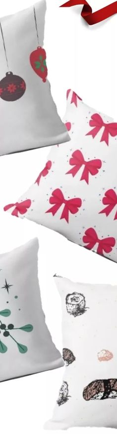 three pillows with red and green designs on them, one has a ribbon tied around it