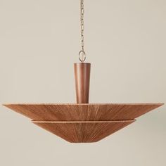 a wooden light fixture hanging from a chain