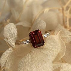 Natural Red Garnet Ring Wedding Ring January Birthstone Ring Emerald Cut Red Gemstone Ring Sterling Silver Ring   Specifications :- ❥ Main Stone - Natural Garnet ❥ Main Stone Size - 7x9mm ❥ Stone - Emerald Cut ❥ Side Stone - Moissanite ❥ Ring Size: I offer more than one (Contact us if your ring size is not available in the listing) ❥ Color: Silver, Gold, Rose Gold, White Gold or Black Rhodium ❥ Material : 925 Sterling Silver, 14K/18K Solid Gold ---> ❥ Makes a Wonderful Gift for your Girlfriend, Red Vintage Engagement Rings, Garnet Diamond Engagement Ring, Garnet Stone Rings For Women, Red Stone Wedding Rings, Burgundy Engagement Ring, Ruby Wedding Ring Vintage, Red Diamond Engagement Ring, Vintage Ruby Engagement Ring, Vintage Ruby Ring