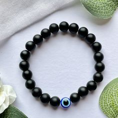 No Nazar Evil Eye Bracelet: Black Bead. Bracelet for women, bracelet for men, bracelet in the UK, bracelet for children bead bracelet in UK. No Nazar Collection - Black Handmade black bead bracelet with one evil eye bead. The evil eye is regarded as a symbol of protection. It is believed that by wearing the evil eye, its watchful gaze will ward off evil spirits by protecting you against any negative energy, jealousy and harm. Perfect as a gift or as a treat for yourself. Size guide: Small: 14 Spiritual Black Evil Eye Bracelet As Gift, Bracelet Ideas For Men, Black Bracelets For Men, Evil Eye Bracelet For Men, Etsy Beaded Bracelets, Black Bracelet For Men, Black Beads Bracelet, Black Bead Bracelet, Beaded Bracelets For Men