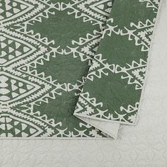 Give your bed a bold, eclectic makeover with this Justina Blakeney Green Aisha Queen Quilt Set! The geometric motifs and rich sage hues will create a gorgeous focal point in your bedroom. Set includes one (1) quilt and two (2) shams Quilt measures 90L x 88W in. Each sham measures 26L x 20H in. Crafted of cotton with 200G cotton fill Features geometric motifs Hues of green and gray 140 thread count Care: Machine wash in cold water on gentle cycle. Do not bleach. Tumble dry on low heat. Use large capacity machine. This item is available at Kirklands.com only, not available in stores. Please note: this item cannot be shipped to APO/FPO addresses. | Justina Blakeney Green Aisha Queen Quilt Set, Green, Queen, Cotton | Kirkland's Home Target Jungalow, Evergreen Color, King Quilt Sets, Reversible Bedding, Justina Blakeney, Colorful Throw Pillows, Cozy Quilts, Green Quilt, Vintage Textile