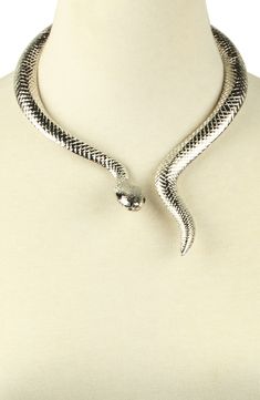 A snake shaped choker necklace adds sultry attitude to your night out looks. 10" length Hinge closure Alloy Imported Party Snake Chain Metal Choker, Party Metal Snake Chain Choker, Silver Snake Chain Choker For Party, Silver Snake Necklace For Party, Trendy Snake-shaped Jewelry For Parties, Trendy Snake-shaped Party Jewelry, Rep Outfits, Snake Outfit, Slytherin Party