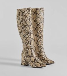 This pair of faux leather boots features a sassy snake pattern, a pointed toe, inner zipper closure, a block heel, and an under-the-knee length fit perfect for styling with skirts or dresses.Fit & Features3" Block heel, 7.5" leg opening, 16" shaft heightSnake pattern, faux leather materialPointed toeInner zipper closureUnder-the-length shaft heightRuns true to size Winter Coat Trends, Animal Print Boots, Homecoming Shoes, Snake Boots, Prom Dress Shoes, Snakeskin Boots, Coat Trends, Animal Print Shoes, Faux Leather Boots