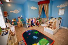 a child's play room with toys and furniture