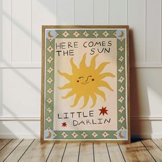 there is a sign that says here comes the sun little dahlin