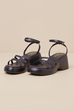 Whether you dress 'em up or dress 'em down, the Lulus Prescott Black Strappy Platform Ankle Strap Sandals are ready to hit the streets! Smooth faux leather shapes these must-have sandals with an almond-shaped footbed, crisscrossing toe straps, and a slender vamp strap (all atop a 1"" toe platform). Matching straps sprout from the sides to host a slender ankle strap with an adjustable silver buckle. A chunky block heel completes the look! Available in whole sizes only. 3" platform heel. Lightly c Strappy Chunky Heels, Chunky Black Sandals, Ankle Strap Sandals Heels, Almond Shaped, Sandal Heels, Chunky Block Heels, Dress Shoes Womens, Platform Heel, Dress Sandals