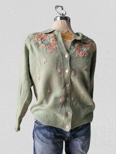 Vintage green embroidered floral sweater  cardigan  .Wool and acrylic Excellent condition.  Size M Please check measures for better fit: Shoulder to shoulder: 20inches sleeves 24inches Bust: 42inches Length: 28inches Winter Floral Print Cotton Cardigan, Floral Print Cotton Cardigan For Winter, Green Cotton Sweater For Spring, Spring Green Cotton Sweater, Spring Floral Embroidered Long Sleeve Cardigan, Long Sleeve Floral Embroidered Cardigan For Spring, Spring Wool Long Sleeve Cardigan, Vintage Floral Print Spring Cardigan, Green Cotton Sweater With Button Closure