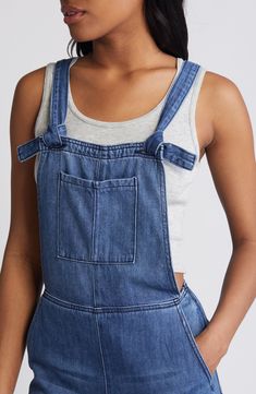 Raw hems and light fading give lived-in appeal to these laid-back overalls cut with a relaxed, straight-leg fit. 29" inseam Square neck Adjustable buckle straps 73% cotton, 27% rayon Machine wash, tumble dry Imported Medium Wash Shortalls With Adjustable Straps, Everyday Dark Wash Overalls With Pockets, Medium Wash Relaxed Fit Bib Front Jeans, Relaxed Fit Bib Front Denim Jeans, Relaxed Fit Medium Wash Overalls With Adjustable Straps, Relaxed Fit Denim Jeans With Bib Front, Medium Wash Denim Jumpsuit With Adjustable Straps, Casual Straight Leg Denim Blue Overalls, Casual Denim Blue Jumpsuit With Frayed Hem